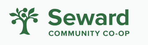 Seward Community Co-op logo with green tree graphic and text on a light background.